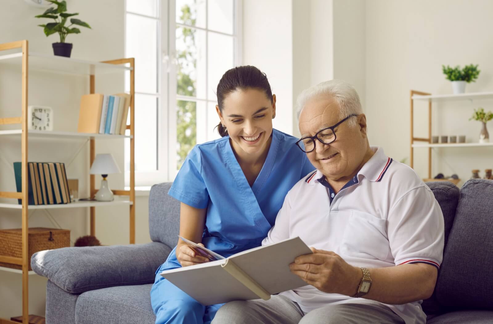 A mature adult embracing their loved one in memory care.