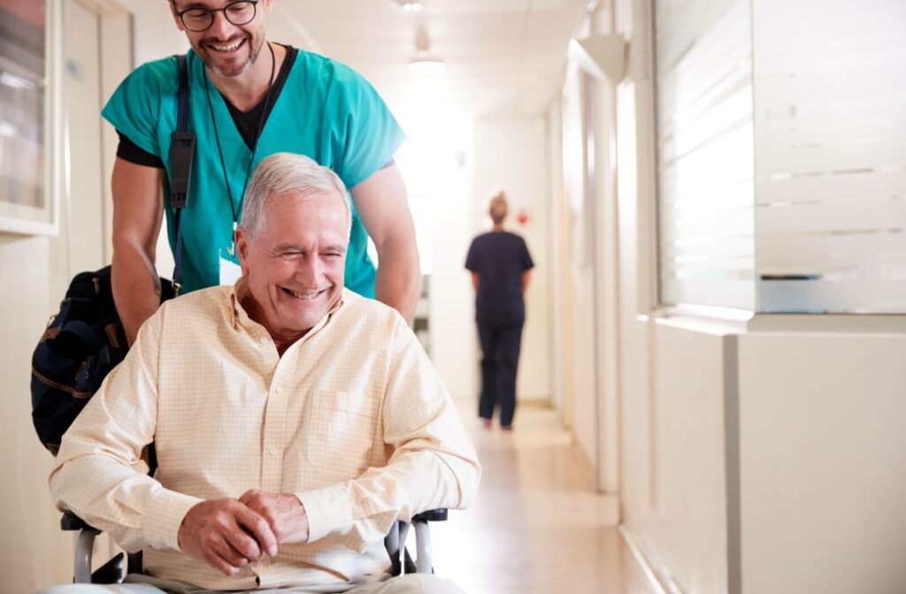 Skilled nurse assisting patient back to their room in a healthcare facility.